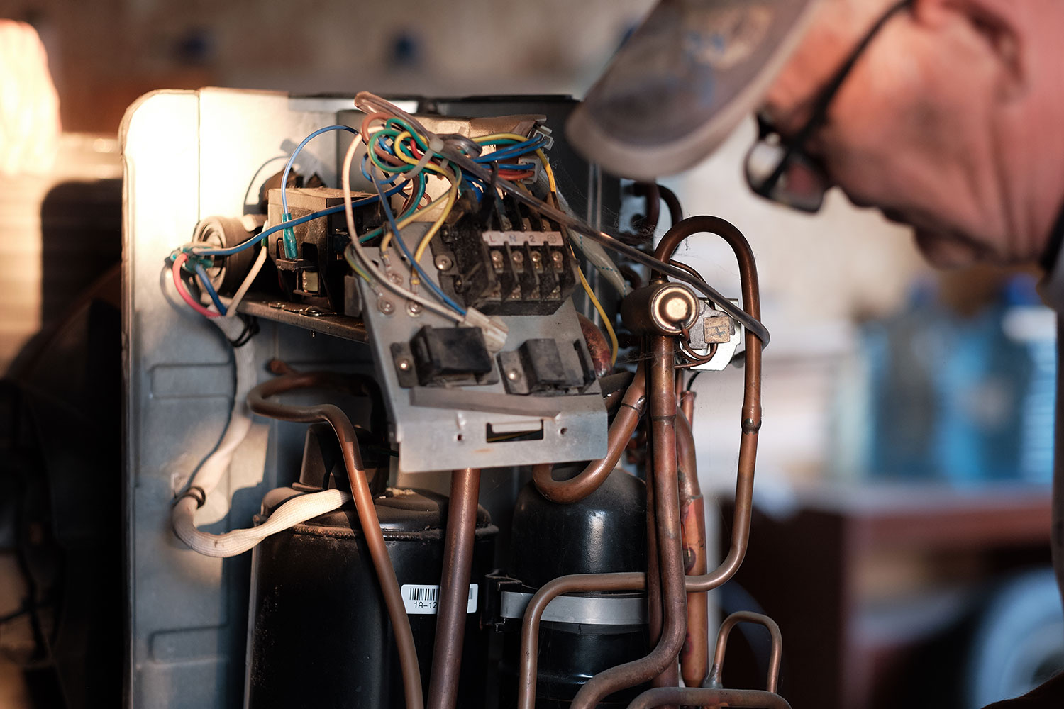 Residential HVAC technician performing AC repairs in Spring, TX