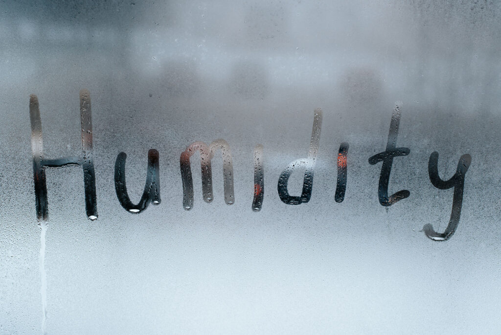 word humidity written on condensation on window