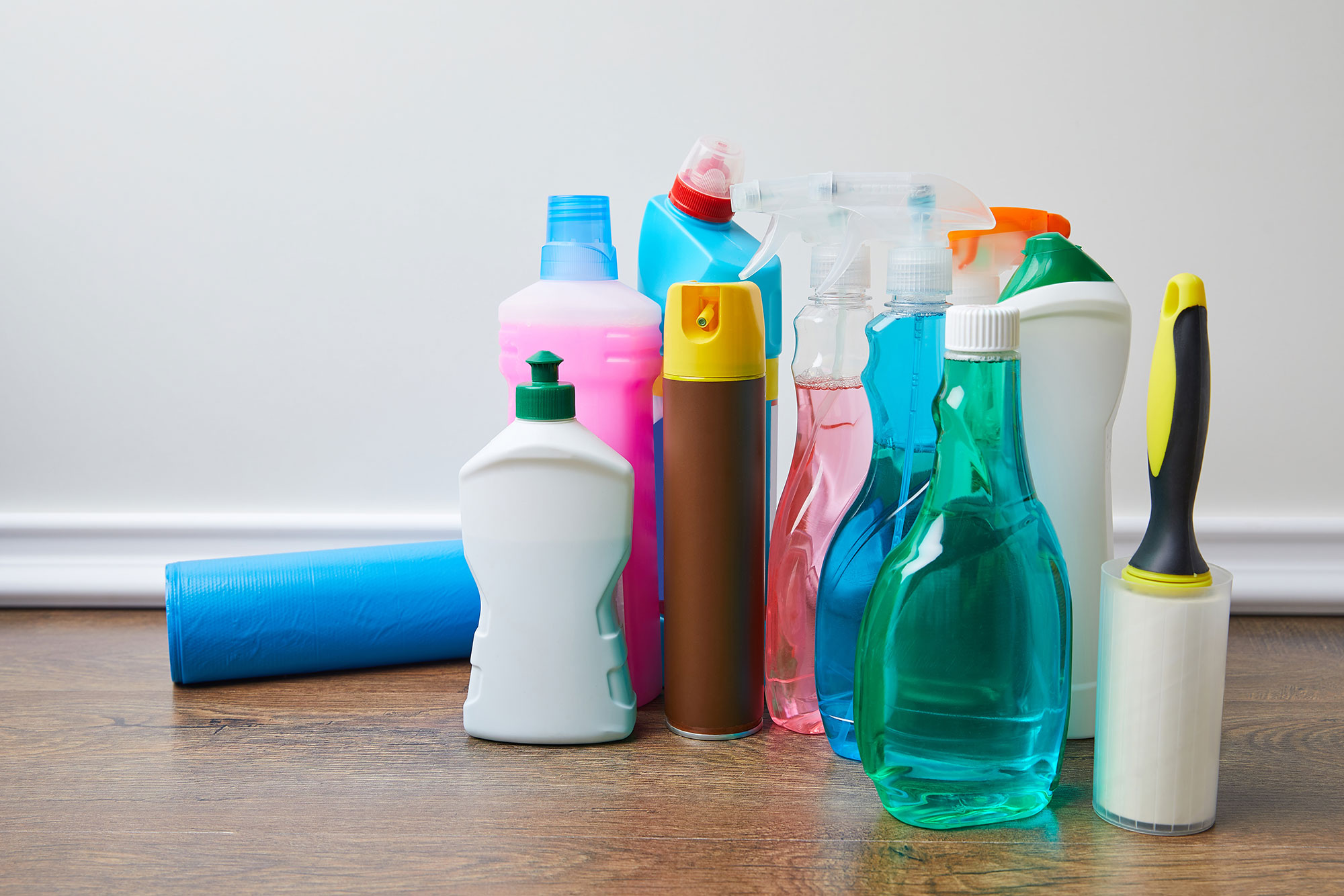 spray bottles and other containers with household cleaning chemicals