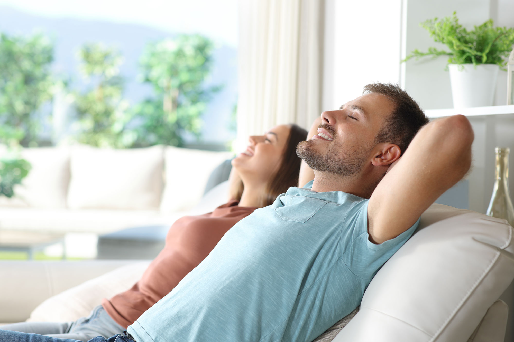Couple in home enjoying nice air conditioning